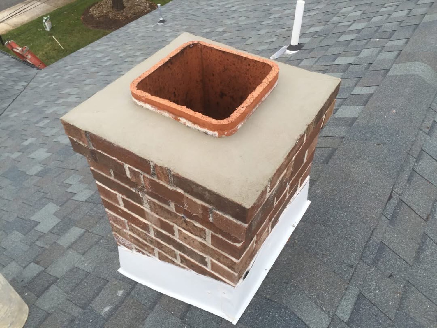 Real Eterno project — rebuilt brick chimney with new clay flue