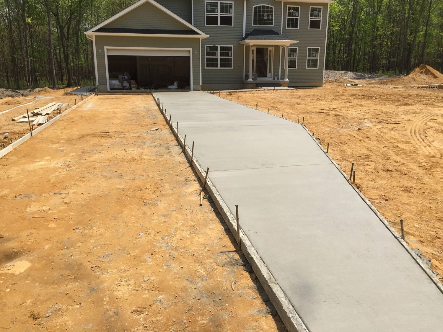 Real Eterno Masonry project — Poured Driveway